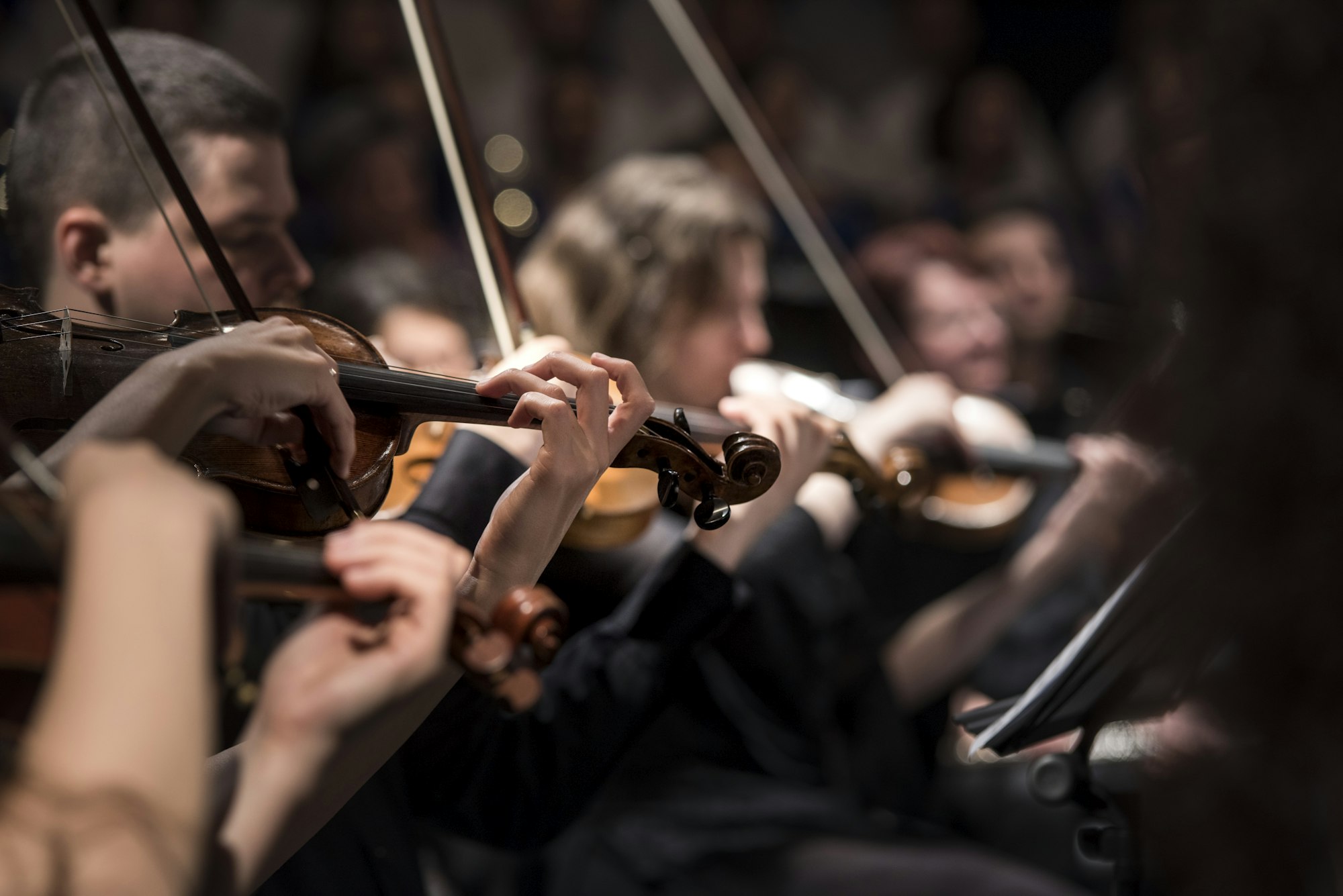 Community gathering around musicians performing together